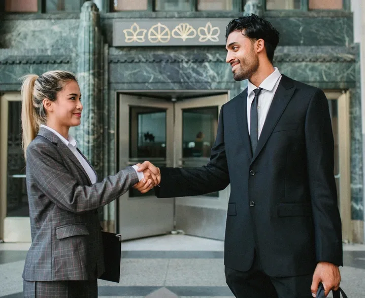 uk 2 people shaking hands