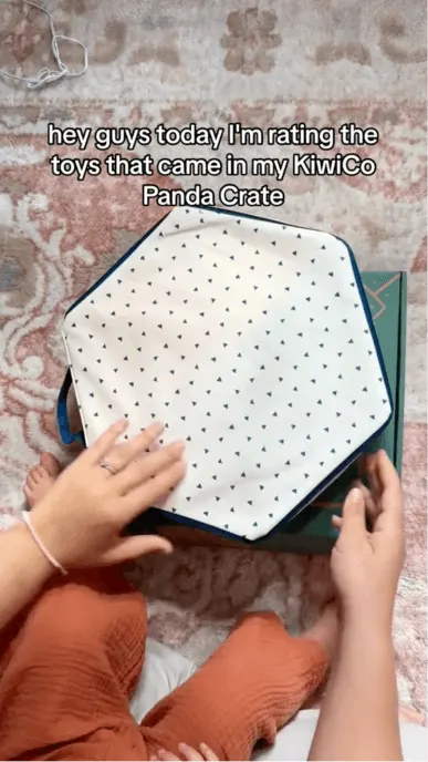 Still from social media post with child opening their KiwiCo Panda Crate