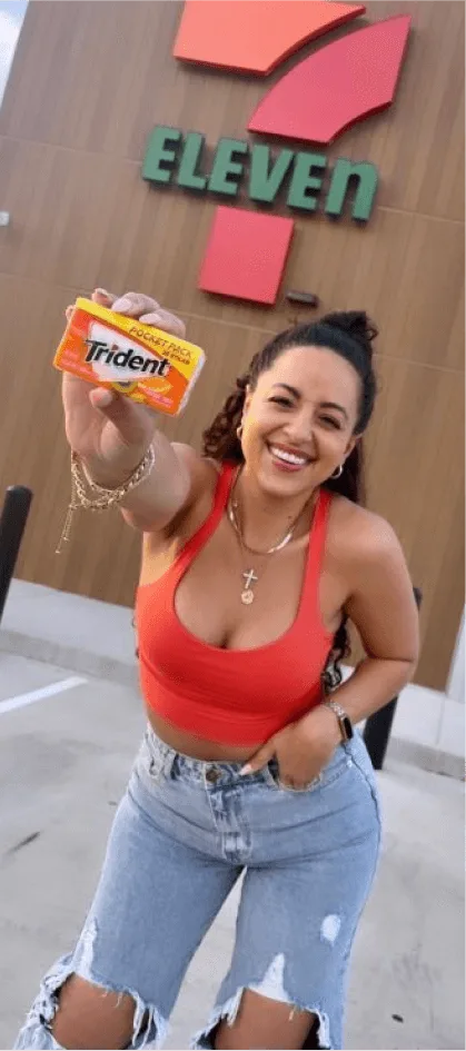 Creator posing with Trident gum outside 7 11 next to key campaign results