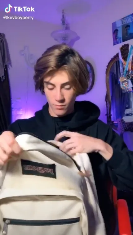 Still of TikTok from KevBoyPerry with a white JanSport backpack