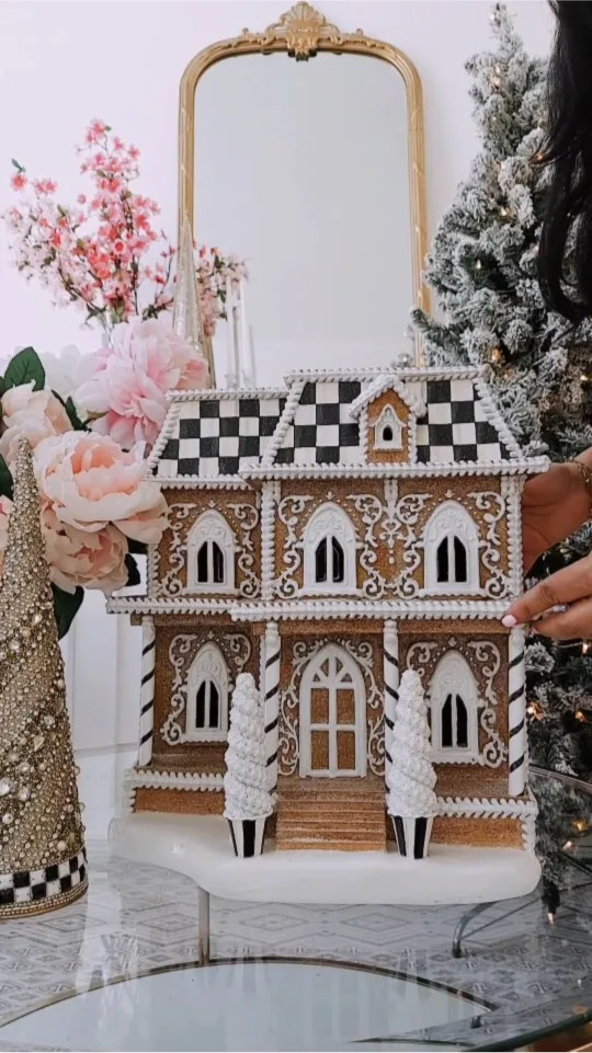 Sponsored MacKenzie Childs IG post with a mirror and gingerbread house