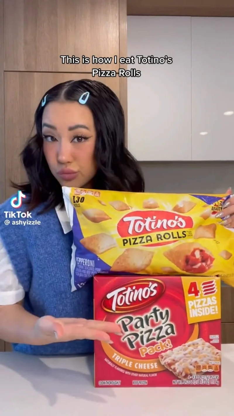 Still of a TikTok creator promoting Totinos pizza rolls and party pizza pack