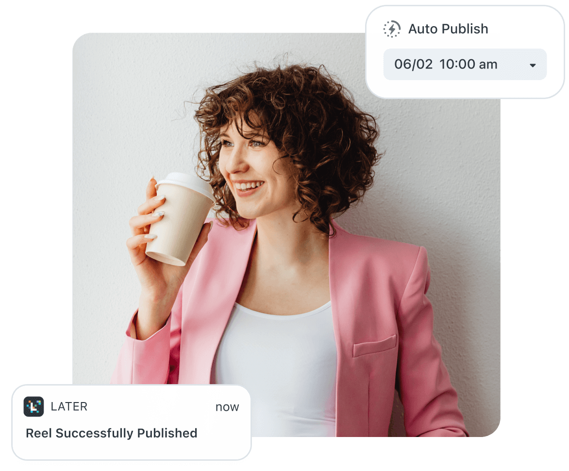 Curly haired woman in a pink blazer smiles while her Instagram reel is auto posted using Later Auto Publish