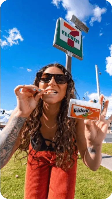 Creator chews Trident gum while posing outside of 7 11