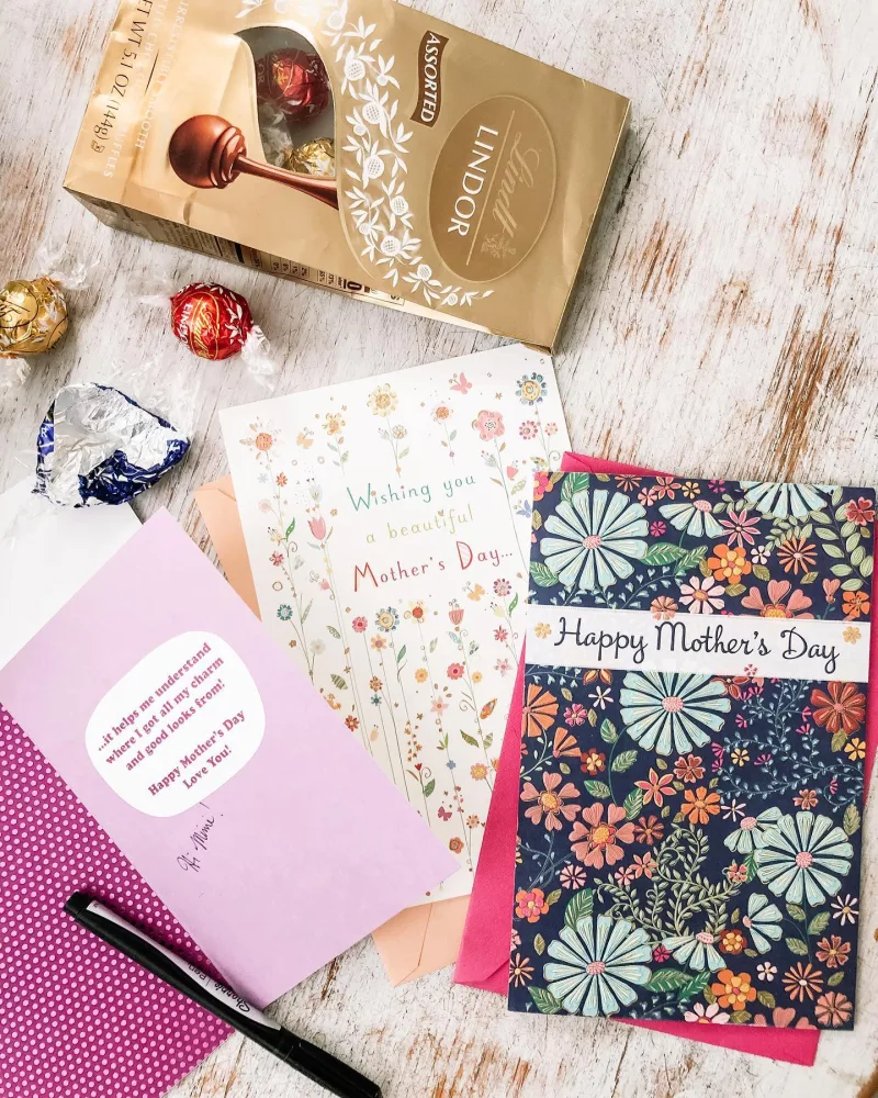 Three mothers day cards next to a Lindt chocolate bag