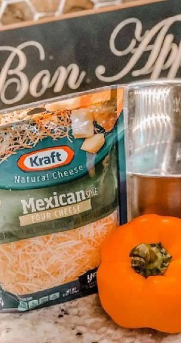 A bag of Kraft Mexican shredded cheese and a pepper