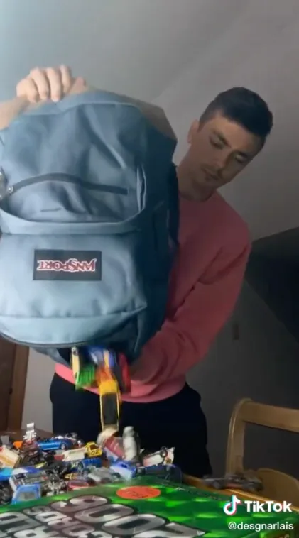 Still of TikTok from Brandon DesJarlais with a blue JanSport backpack