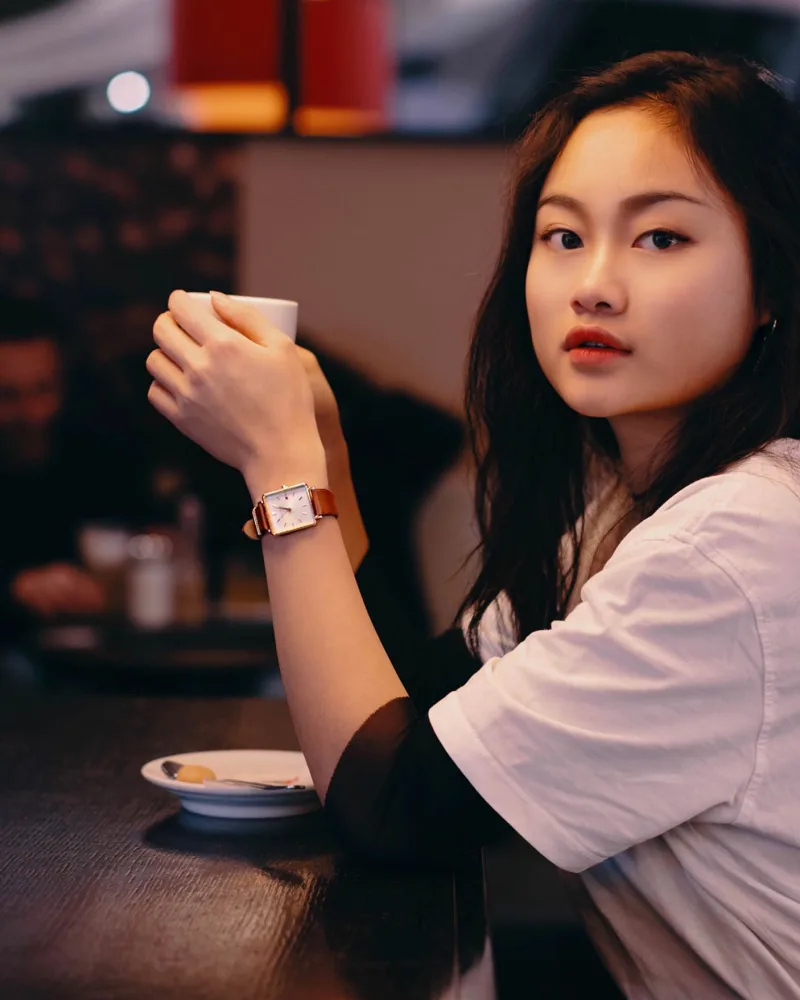 Creator Tongtong Zhang wearing brown leather Boxy Rosefield watch