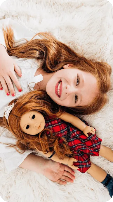 Family influencers playing with their American Girl dolls