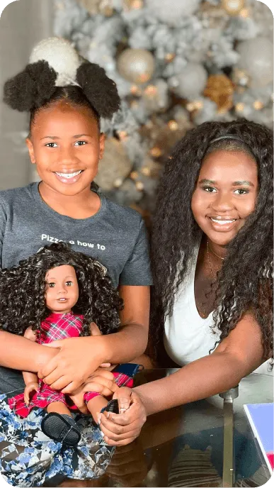 Ethnically diverse family influencers posing with their American Girl dolls