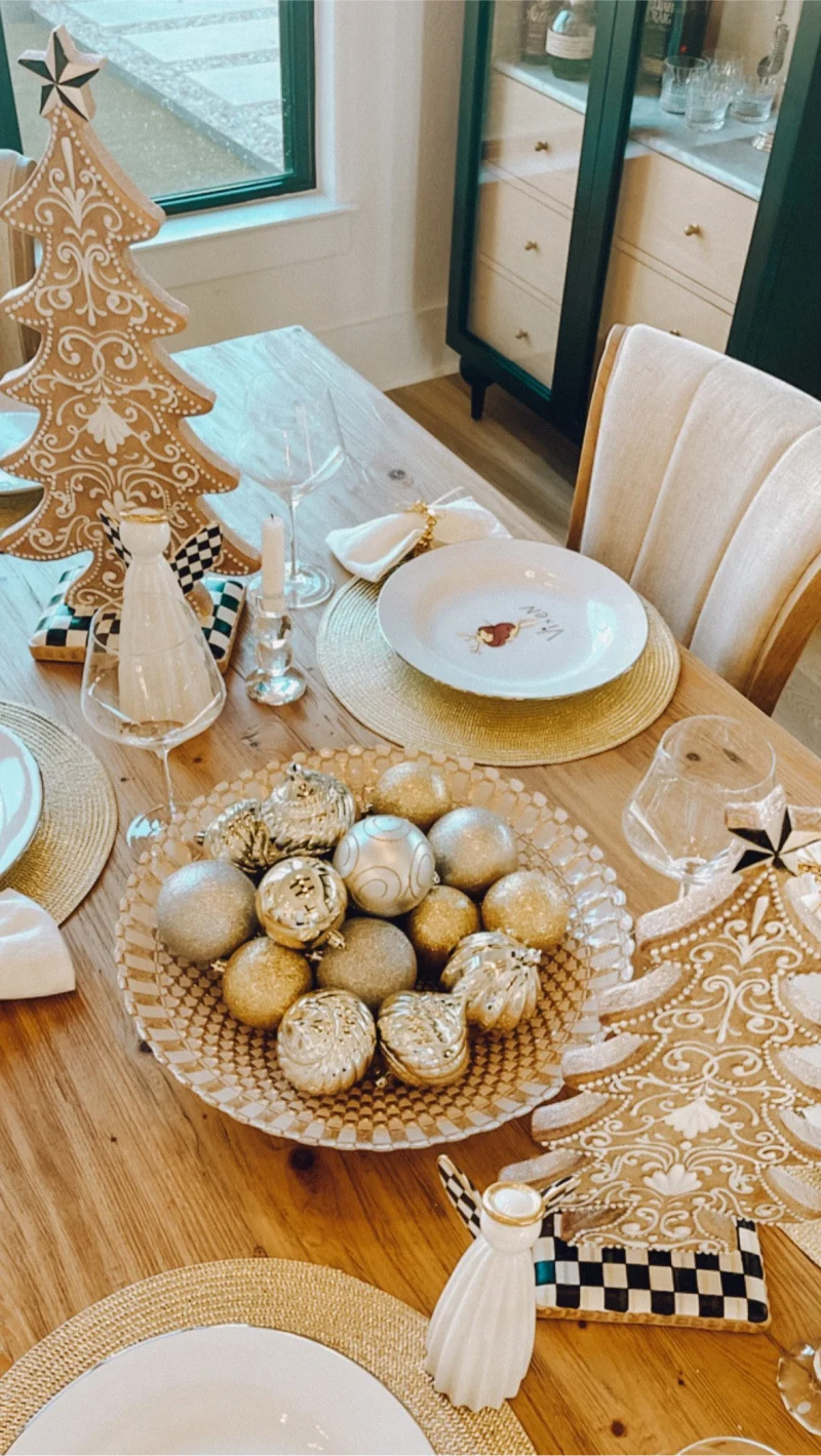 Instagram post of a Christmas table set with MacKenzie Childs decor