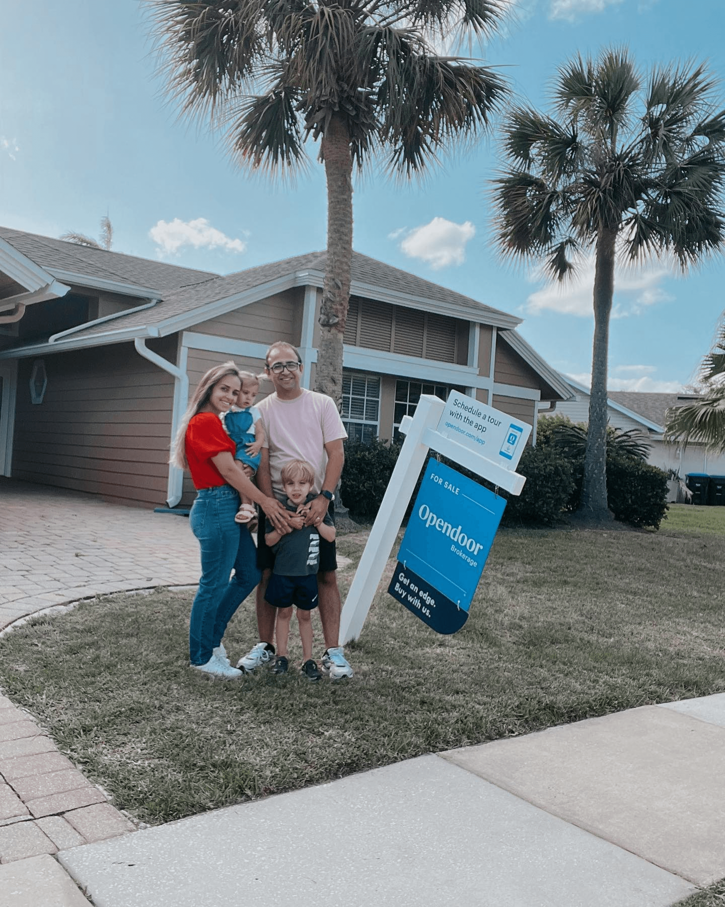 Young family poses in front of home with OpenDoor sign next to key campaign results"