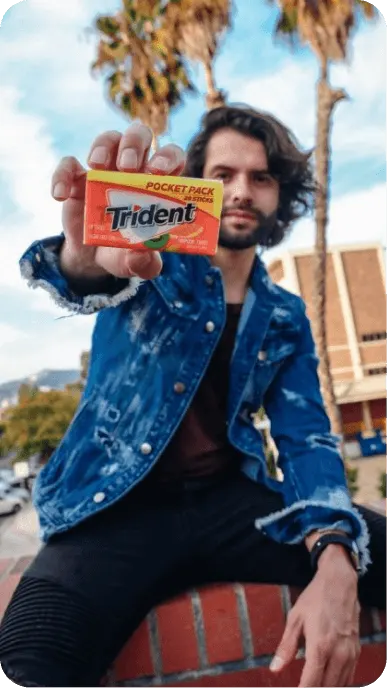 Creator poses with Trident gum packet