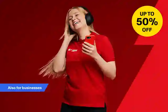 A smiling woman listens to music with headphones while holding a phone. Sale up to 50% off.