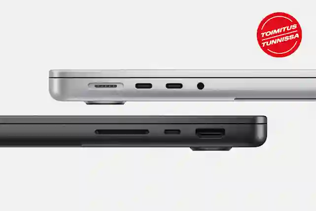 Hopea ja musta Macbook Pro kuvattuna sivulta, jossa on esillä eri liitännät. Toimitus tunnissa pallero.