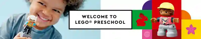 Hymyilevä lapsi ja Duplo-ukkeli. LEGO alle kouluikäisille.