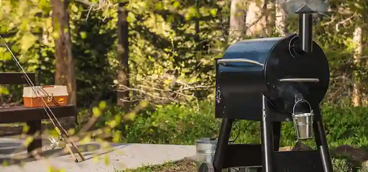 Pellet grill in a backyard.