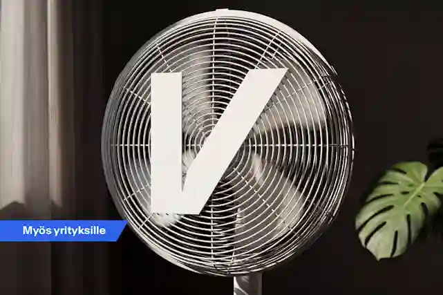 Pyöreä pöytätuuletin sisätilassa, tuulettimen edessä suuri valkoinen V‑kirjain. Vasemmassa alakulmassa sininen merkki tekstillä ”Myös yrityksille”.