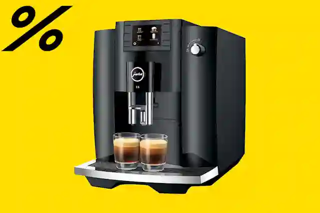 Musta prosentti logo ja vieressä kahvikone. Tutustu tarjouksiin!