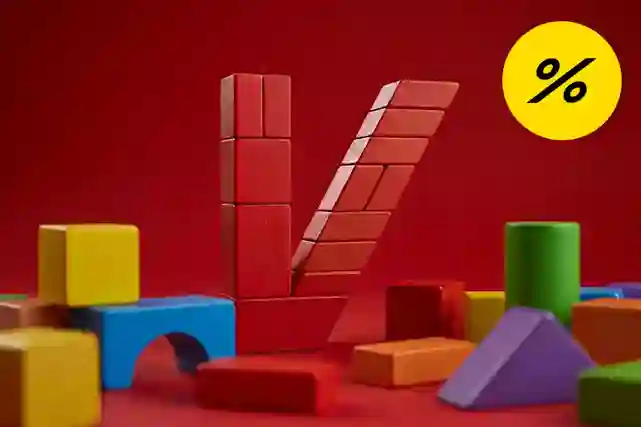 Värikkäitä puuleluja punaisella taustalla muodostavat V-kirjaimen. Alennusmerkki oikeassa yläkulmassa.