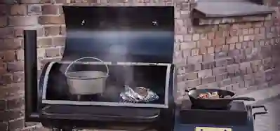 A smoker in a backyard.