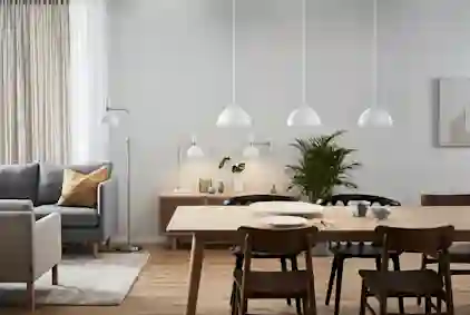 Kuva siististi valaistusta keittiöstä.