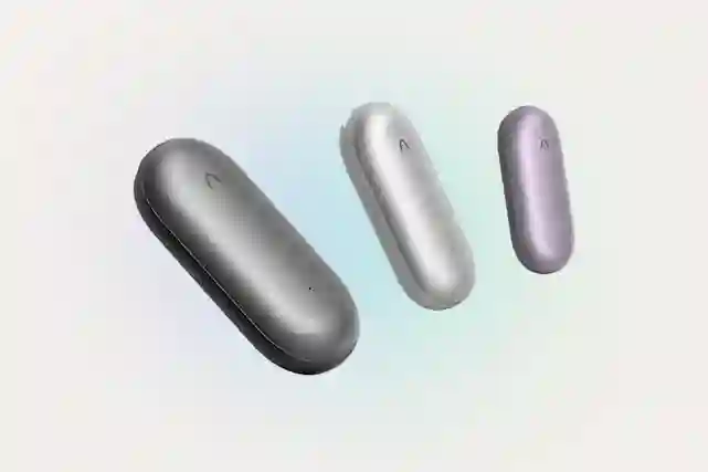 Three oval-shaped wireless voice recorders in gray, silver, and light purple.