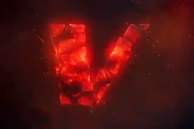 V-logo joka koostuu punaisista tuli kuumista hiilistä ja sen ympärillä lentelee kipinöitä.