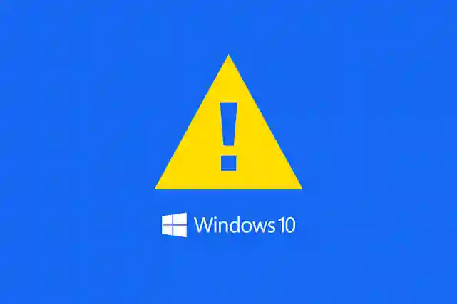 Windows 10 -logo ja iso varoitus kolmio kuvaamassa huomiota!