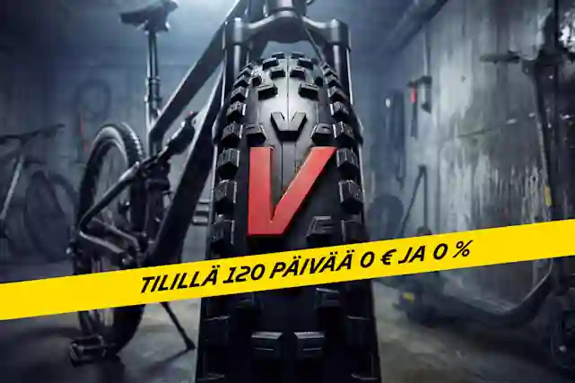 Pyörävarastosta kuva, jossa lähikuvassa polkupyörän renkaassa oleva punainen V-logo, joka on yksi iso kumiosa renkaassa. Taustalla sähköskuutti ja polkupyörä. Tutustu valikoimaan. Nauhassa teksti:"Tilillä 120 päivää 0 € ja 0 %".