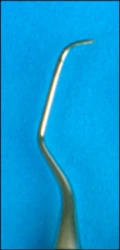 La figure 28 montre une curette Langer 5/6