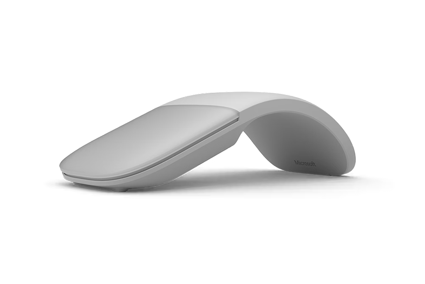 Image of a gray Surface Arc Mouse on a table in a gray background