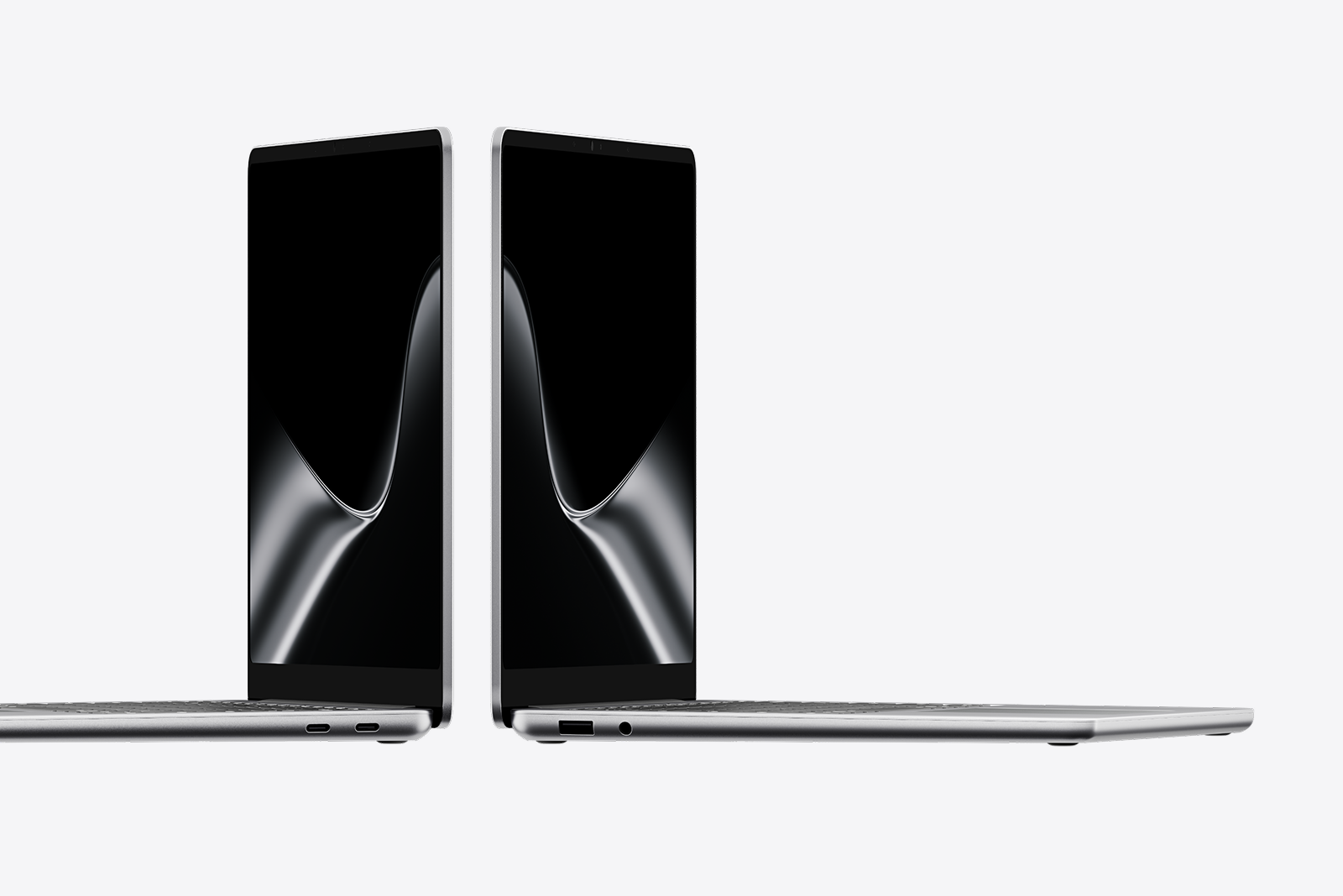A pair of Surface Laptops facing away from each other displaying the dark ribbon screen saver against a gray background