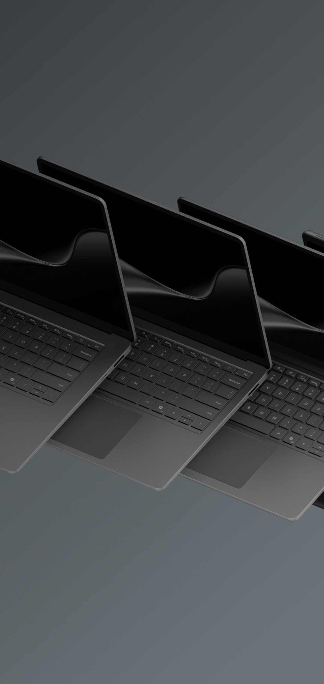 A group of 5 Surface devices with a dark ribbon image