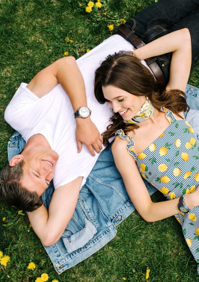 Couple laying on the Green lawn