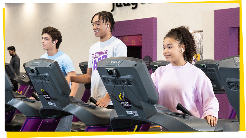 Teens working out at Planet Fitness with the High School Summer Pass program.