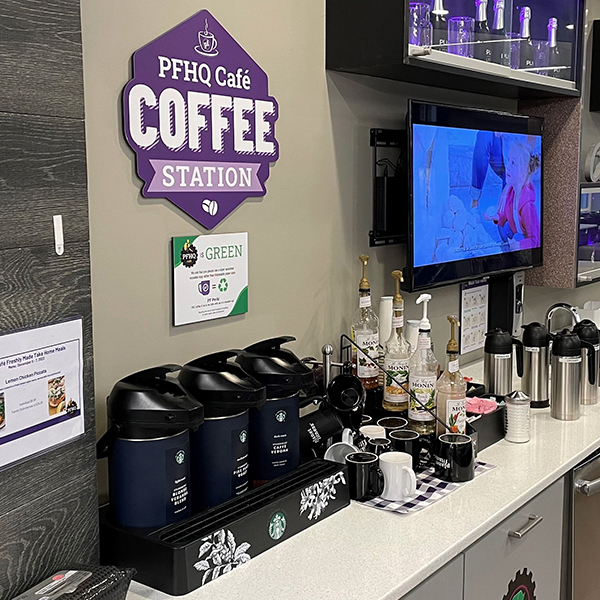 Planet Fitness team member getting her morning coffee in the Planet Fitness Cafe.