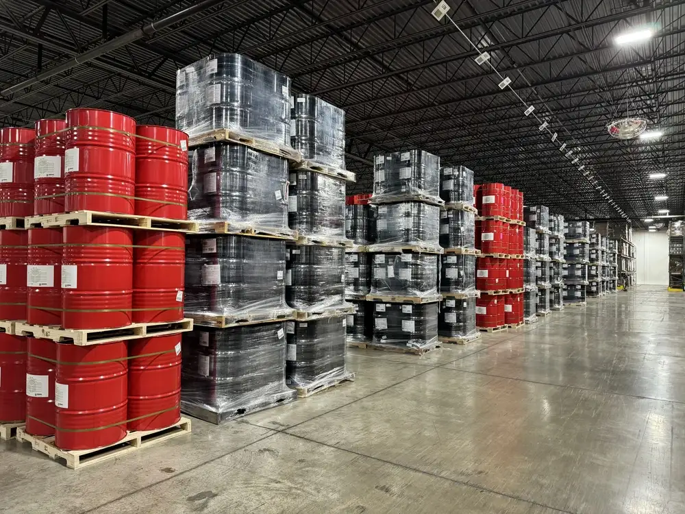 warehouse-interior-stacks-of-red-and-black-barrels-angled-perspective-shot-1