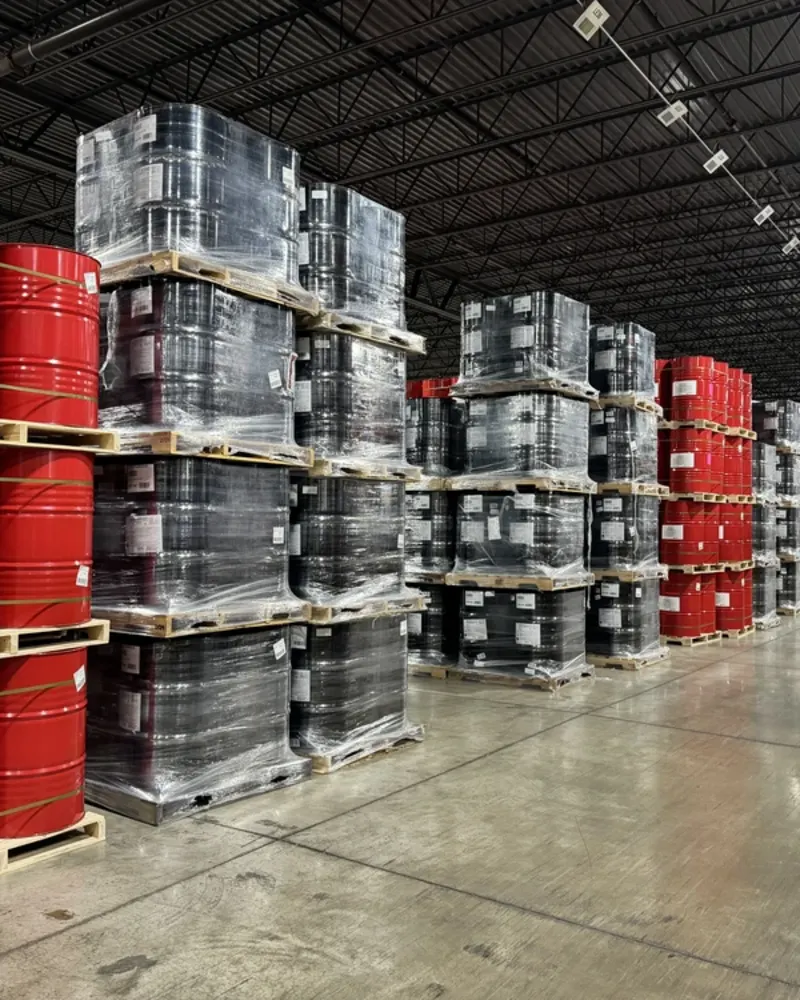 warehouse-interior-stacks-of-red-and-black-barrels-angled-perspective-shot-1