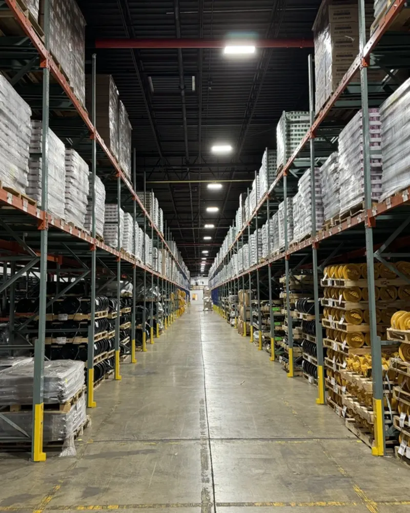 warehouse-interior-large-blocks-of-boxed-cans-and-yellow-construction-parts-deep-hallway-perspective-shots