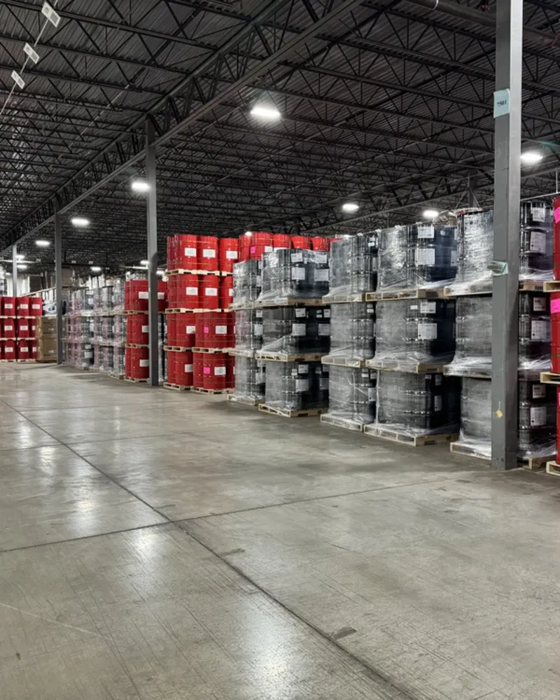 warehouse-interior-stacks-of-red-and-black-barrels-angled-perspective-shot-2
