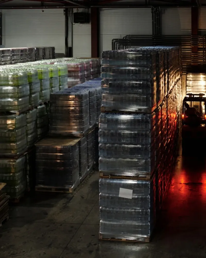 forklift-moving-forward-along-aisle