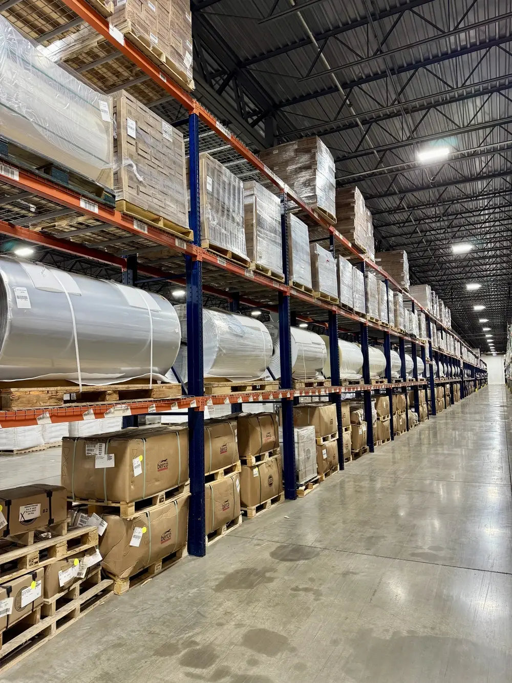 warehouse-interior-barrels-and-boxes-on-shelves