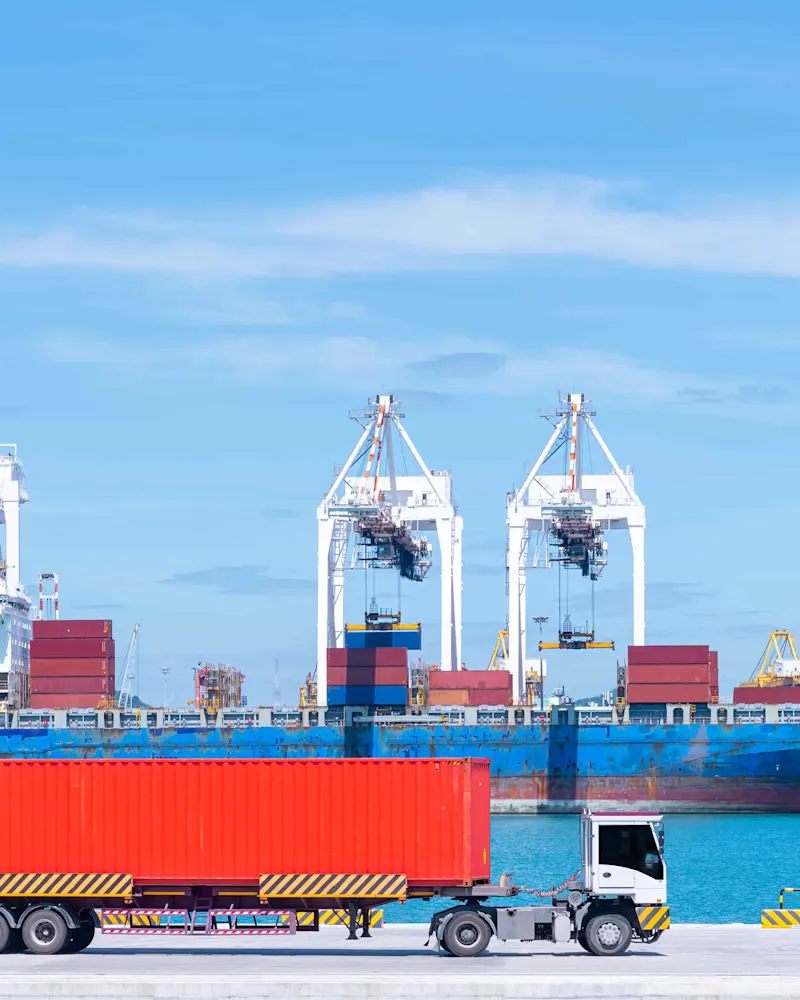 cargo-ship-and-truck-at-seaport-waiting-for-contai-2026-03-24-09-05-36-utc (1)