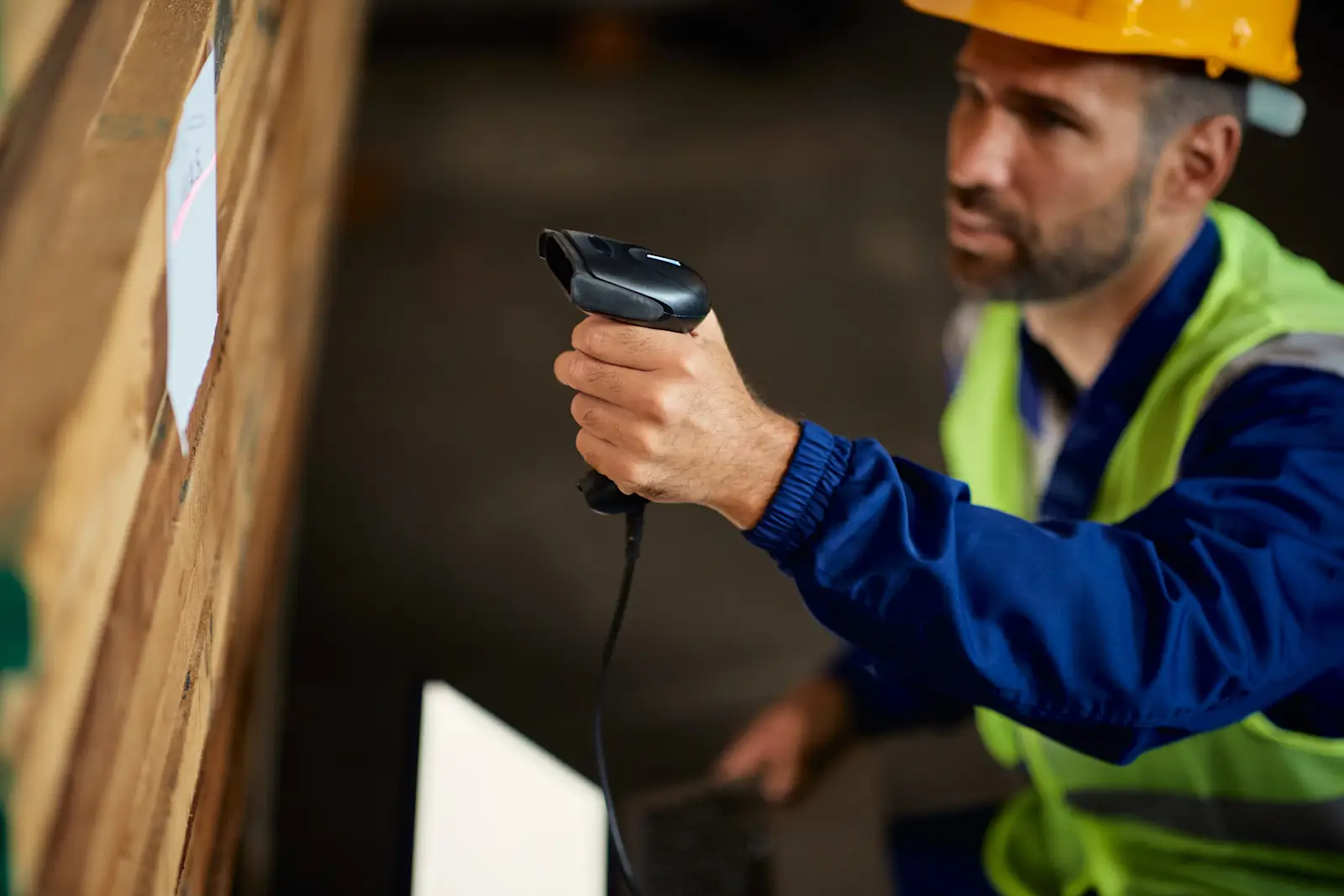 Worker scanning the label