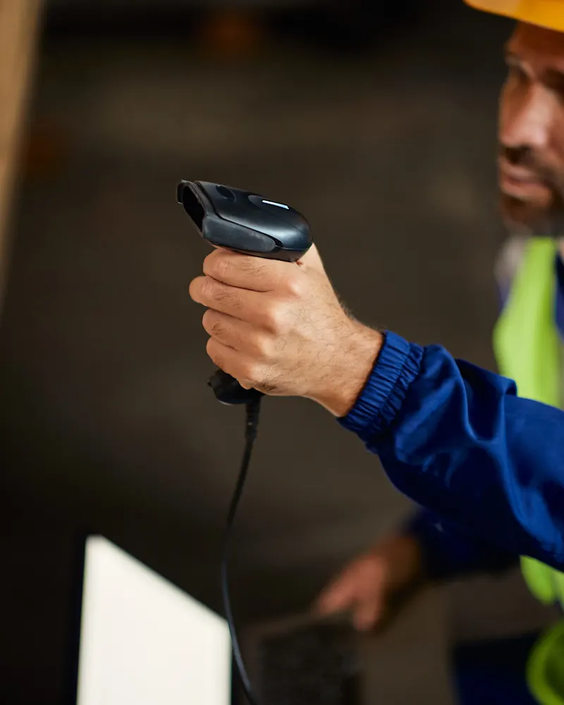 Worker scanning the label