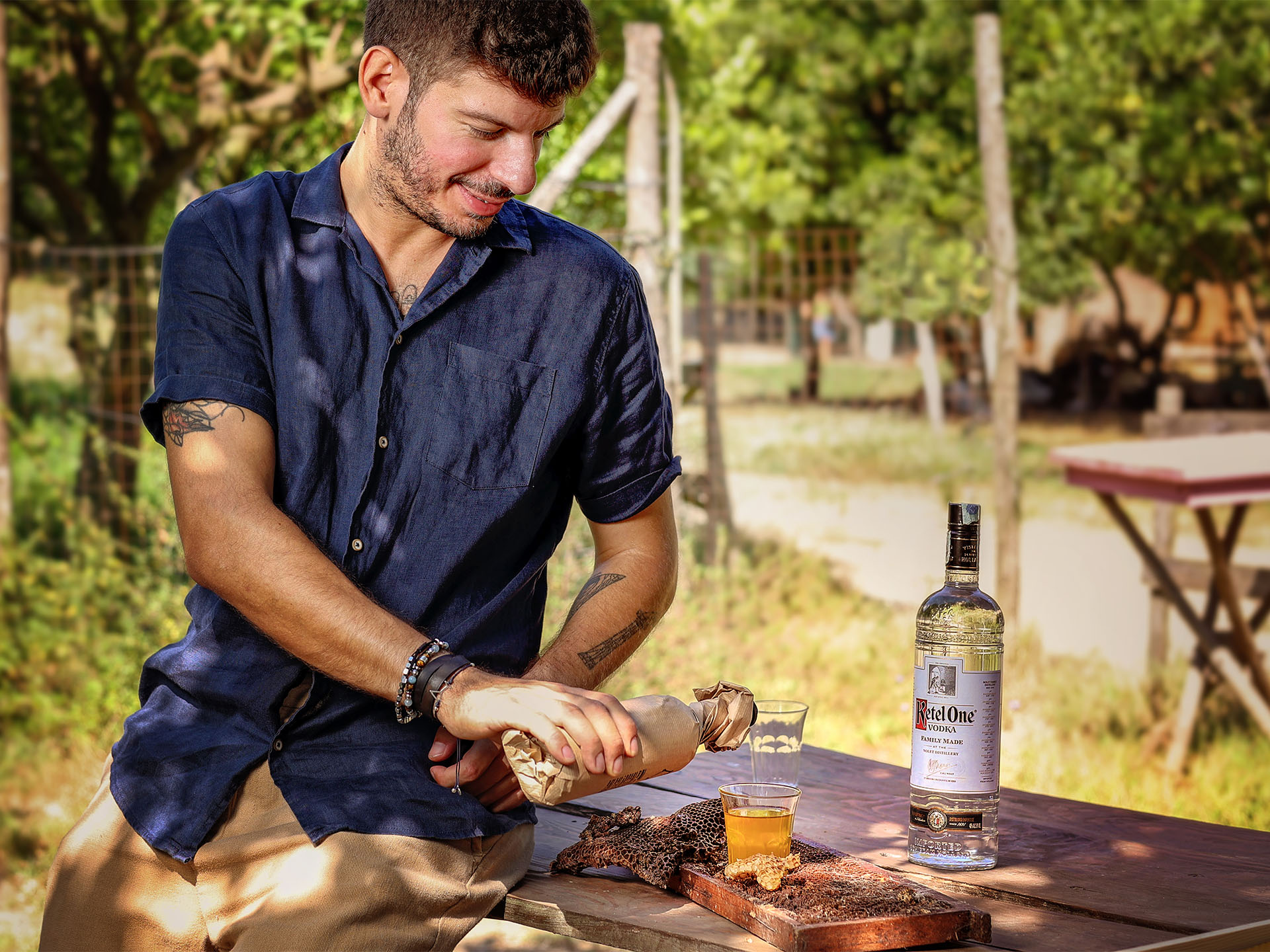 Vincenzo Pagliara pouring from a bottle outside