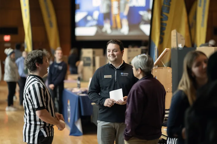 students talking at an involvement fair