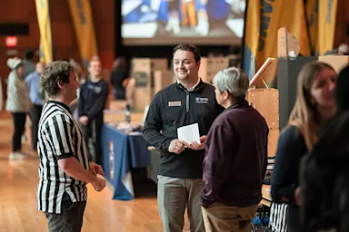 students talking at an involvement fair