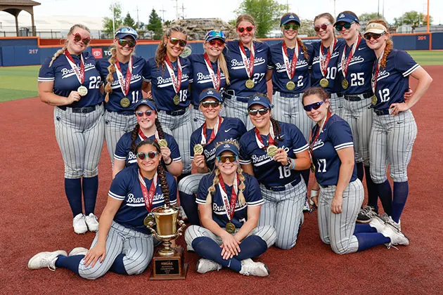 Photo of the Brandywine softball team with medals and a trophy